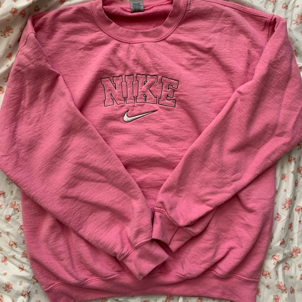 pink embroidered NIKE sweatshirt